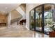 Impressive entry with grand staircase, high ceilings, and elegant flooring at 4 Bloomfield Hills Dr, Henderson, NV 89052