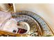 Elegant curved staircase with ornate railing at 4 Bloomfield Hills Dr, Henderson, NV 89052