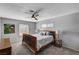 Bedroom with a ceiling fan, wood bed frame, and carpeted flooring at 4008 Snead Dr, Las Vegas, NV 89107