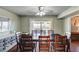 Light-filled dining room boasts backyard access, a ceiling fan, and comfortable seating for Gathering dinners at 4008 Snead Dr, Las Vegas, NV 89107