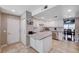 Modern kitchen with white cabinets, stainless steel appliances, and an adjacent eating area for casual dining at 4008 Snead Dr, Las Vegas, NV 89107