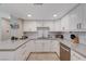 Well-lit kitchen featuring granite counters, white subway tile backsplash, and stainless steel appliances at 4008 Snead Dr, Las Vegas, NV 89107