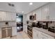 Bright kitchen featuring white cabinets, stainless steel appliances, and a view into the dining room at 4008 Snead Dr, Las Vegas, NV 89107