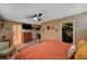 A spacious carpeted main bedroom features a ceiling fan and large closet at 4008 Snead Dr, Las Vegas, NV 89107