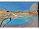 Inviting kidney-shaped pool with a slide in backyard at 4008 Snead Dr, Las Vegas, NV 89107