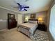 Guest bedroom with dresser, ceiling fan, and window coverings at 420 Rhythm St, Henderson, NV 89074