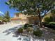 Two-story house with landscaped yard and three-car garage at 420 Rhythm St, Henderson, NV 89074