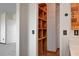 Bathroom featuring open wooden shelving and a glimpse into an adjacent room at 422 Waterbrook Dr, Henderson, NV 89015