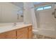 Clean bathroom with shower/tub combo and wood vanity at 422 Waterbrook Dr, Henderson, NV 89015