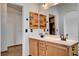 Double sink bathroom vanity with wood cabinets and large mirror at 422 Waterbrook Dr, Henderson, NV 89015