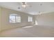 Expansive bedroom with abundant natural light from multiple windows and neutral carpeting at 422 Waterbrook Dr, Henderson, NV 89015