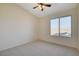 Bright bedroom with ceiling fan and carpet at 422 Waterbrook Dr, Henderson, NV 89015