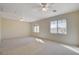 Spacious bedroom with lots of light from several windows, neutral walls, and neutral carpet at 422 Waterbrook Dr, Henderson, NV 89015