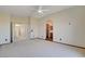 Bedroom featuring neutral walls and carpet with doorways leading to other rooms and bathroom at 422 Waterbrook Dr, Henderson, NV 89015