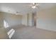 Spacious bedroom featuring neutral walls, carpet and two ceiling fans at 422 Waterbrook Dr, Henderson, NV 89015