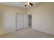 Spacious bedroom with double doors and ceiling fan at 422 Waterbrook Dr, Henderson, NV 89015