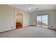 Bedroom featuring a large sliding glass door, ceiling fan and an attached bathroom at 422 Waterbrook Dr, Henderson, NV 89015