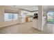 Kitchen with white cabinets, granite counters, and a view of the backyard at 422 Waterbrook Dr, Henderson, NV 89015