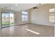 Living room with sliding door leading to a grassy backyard at 422 Waterbrook Dr, Henderson, NV 89015