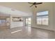 Spacious living room with high ceilings, tile floors, and sliding glass doors at 422 Waterbrook Dr, Henderson, NV 89015