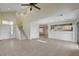 Open living room with high ceilings, tile floors, and staircase at 422 Waterbrook Dr, Henderson, NV 89015