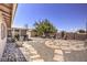 Backyard with patio, fountain, and partial view of house at 427 Shamrock Dr, Henderson, NV 89002