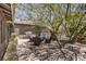 Small backyard patio area with seating under a tree at 427 Shamrock Dr, Henderson, NV 89002