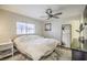 Bright bedroom with ceiling fan and ensuite bathroom at 427 Shamrock Dr, Henderson, NV 89002