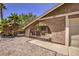 Wrought iron gate leads to a cozy patio seating area at 427 Shamrock Dr, Henderson, NV 89002