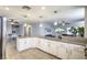 Large kitchen island with granite countertops and white cabinets at 427 Shamrock Dr, Henderson, NV 89002