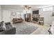 Living room with a brick fireplace and tiled floors at 427 Shamrock Dr, Henderson, NV 89002