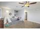 Charming playroom with a teepee, built-in shelving and ceiling fan at 427 Shamrock Dr, Henderson, NV 89002