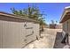 Tan colored storage shed in backyard at 427 Shamrock Dr, Henderson, NV 89002