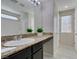 Bathroom with granite countertop and large mirror at 4530 Lime Straight Dr, Las Vegas, NV 89115