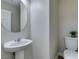 Small bathroom with pedestal sink and toilet at 4530 Lime Straight Dr, Las Vegas, NV 89115