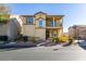 Two-story house with balcony, landscaping, and driveway at 4530 Lime Straight Dr, Las Vegas, NV 89115