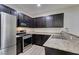 Modern kitchen with stainless steel appliances and granite countertops at 4530 Lime Straight Dr, Las Vegas, NV 89115