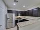 Modern kitchen with stainless steel appliances and granite countertops at 4530 Lime Straight Dr, Las Vegas, NV 89115