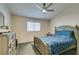 Spacious bedroom with a queen bed and ceiling fan at 5417 Lemhi Ct, North Las Vegas, NV 89031