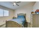 Serene bedroom with a queen bed and ceiling fan at 5417 Lemhi Ct, North Las Vegas, NV 89031