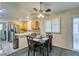 Bright dining area with four chairs and kitchen access at 5417 Lemhi Ct, North Las Vegas, NV 89031