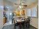 Bright dining area with four chairs and kitchen access at 5417 Lemhi Ct, North Las Vegas, NV 89031