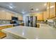 Modern kitchen with stainless steel appliances and light wood cabinets at 5417 Lemhi Ct, North Las Vegas, NV 89031