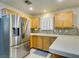 Kitchen boasts stainless steel appliances and light wood cabinets at 5417 Lemhi Ct, North Las Vegas, NV 89031