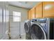 Laundry room with washer, dryer, and storage at 5417 Lemhi Ct, North Las Vegas, NV 89031