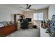 Home office space with a corner desk and ceiling fan at 5417 Lemhi Ct, North Las Vegas, NV 89031