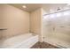 Bathroom featuring a soaking tub and a glass-enclosed shower at 5490 Tulip Hill Ave, Las Vegas, NV 89141