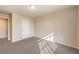 Neutral bedroom with carpet, a double door closet, and sun-drenched window at 5490 Tulip Hill Ave, Las Vegas, NV 89141