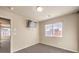 Bedroom with mounted TV and window at 5490 Tulip Hill Ave, Las Vegas, NV 89141