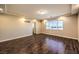 Bright bedroom with wood floors and a large window offering plenty of natural light at 5490 Tulip Hill Ave, Las Vegas, NV 89141